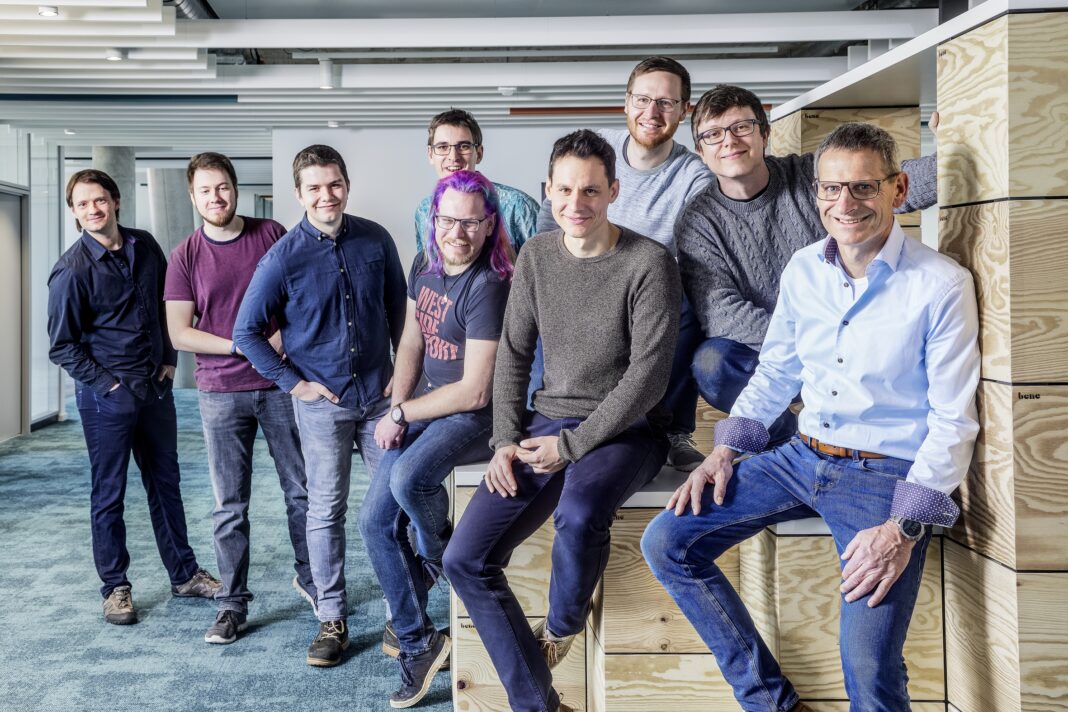 Jürgen Peters (centre), Head of Software Development at Arburg, with his Innovation Hub team in Karlsruhe. More IT and software experts are always welcome at Arburg.